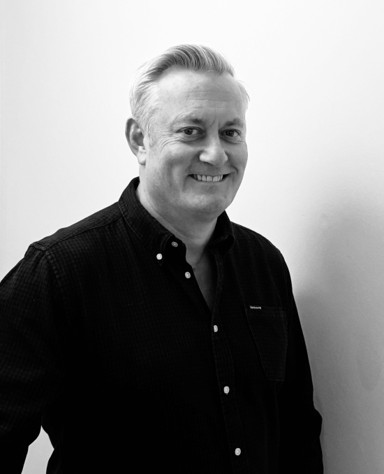 Black and white portrait of Alastair Smith, Director Supply Chain & Procurement.